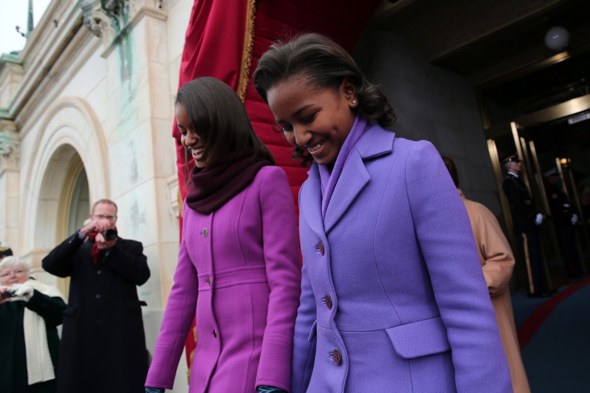 Malia and Sasha arrive for the presidential Inauguration on the West Front of the U.S. Capitol.