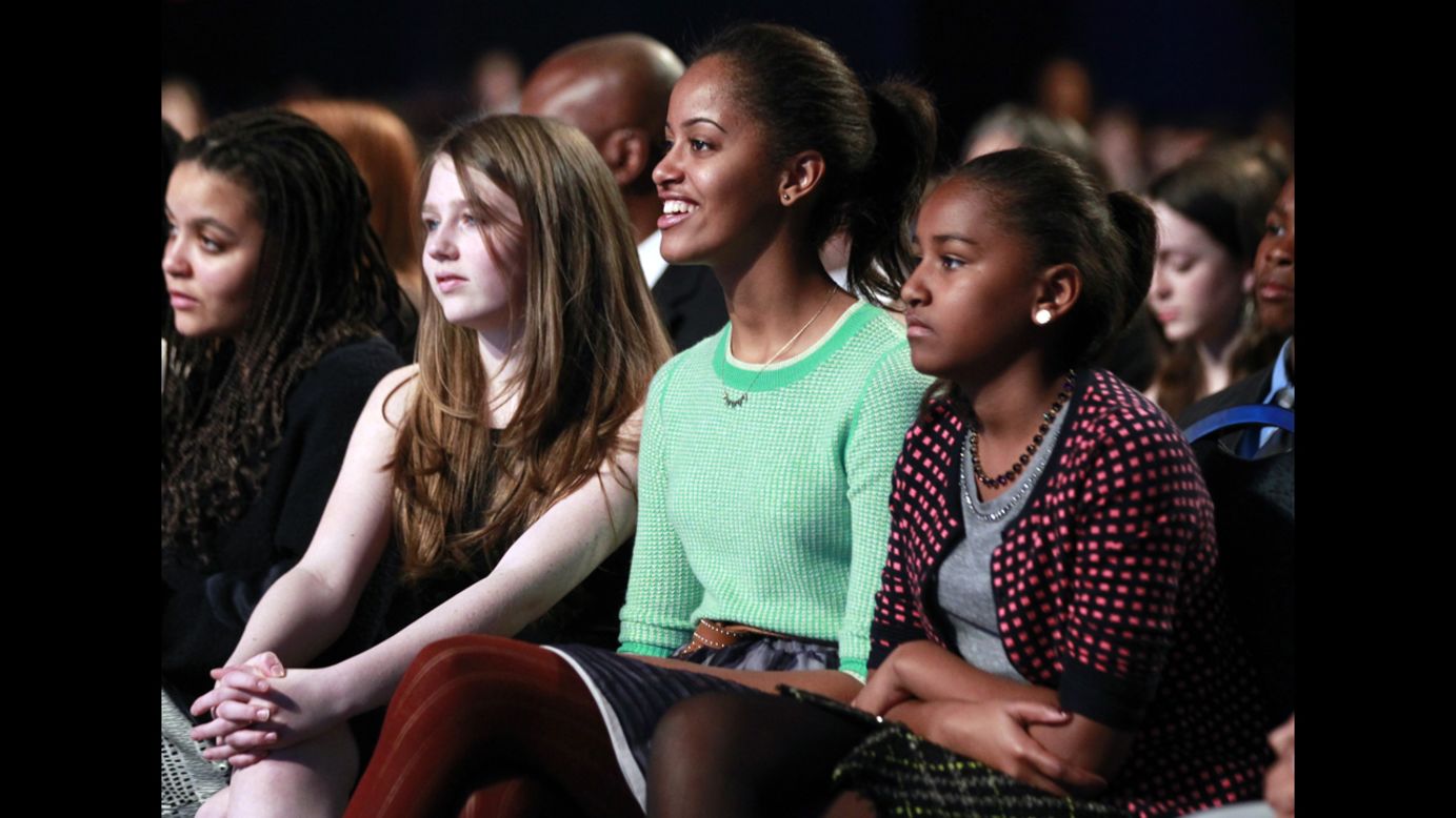 From right, Sasha and Malia watch the Kids' Inaugural Concert on January 19 for children and military families, one of the events ahead of the second-term Inauguration of President Obama.