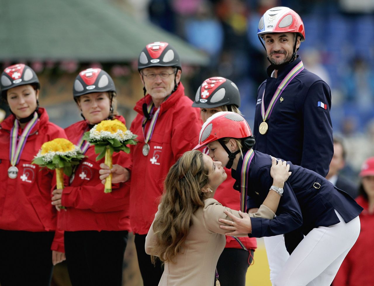 Princess Haya congratulates Virgine Atger, a member of the winning French team at the World Equestrian Games in Aachen in Germany in 2006. 