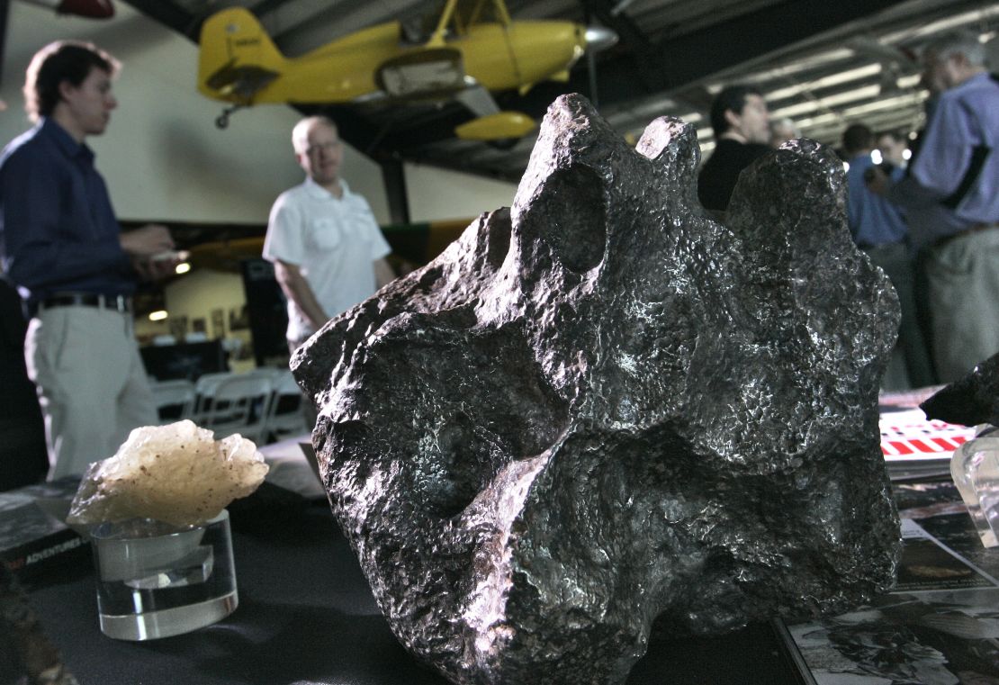 Meteorites sit on a display table Tuesday at the Deep Space Industries announcement of plans for the world's first fleet of commercial asteroid-prospecting spacecraft at the Museum of Flying in Santa Monica, California.
