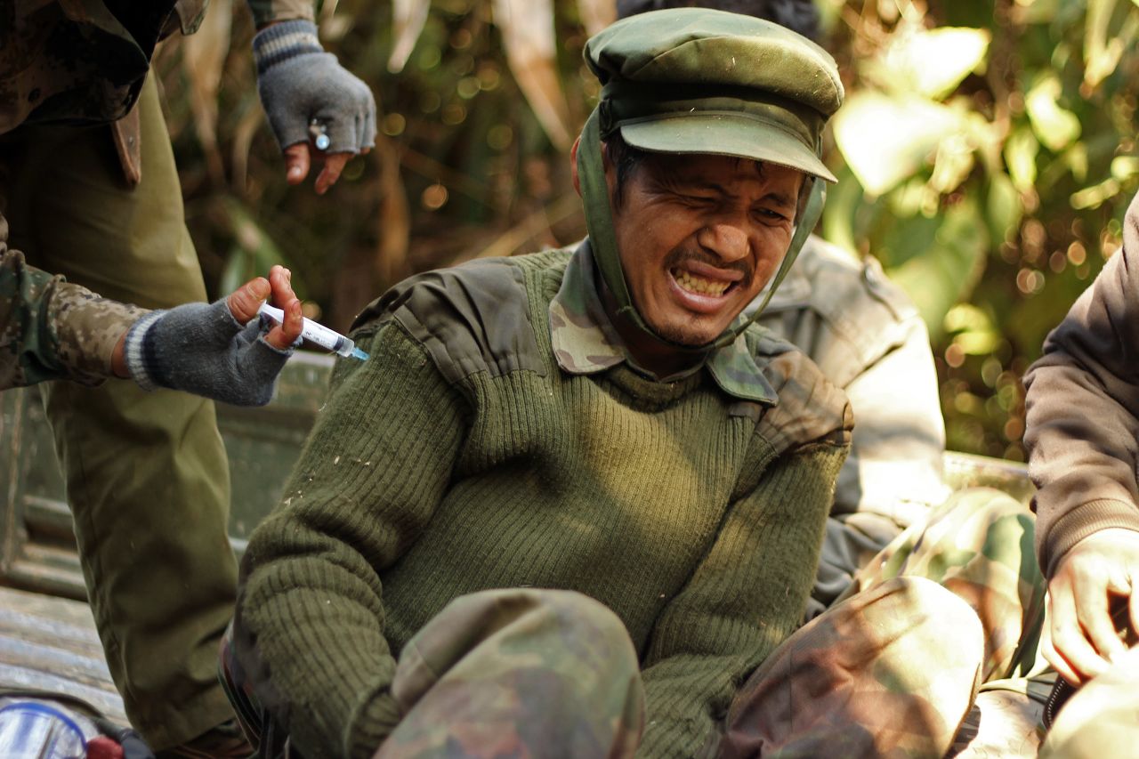 An injured Kachin Independence Army soldier receives an injection from a medic on Hka Ya mountain in Kachin province on January 20, 2013. 