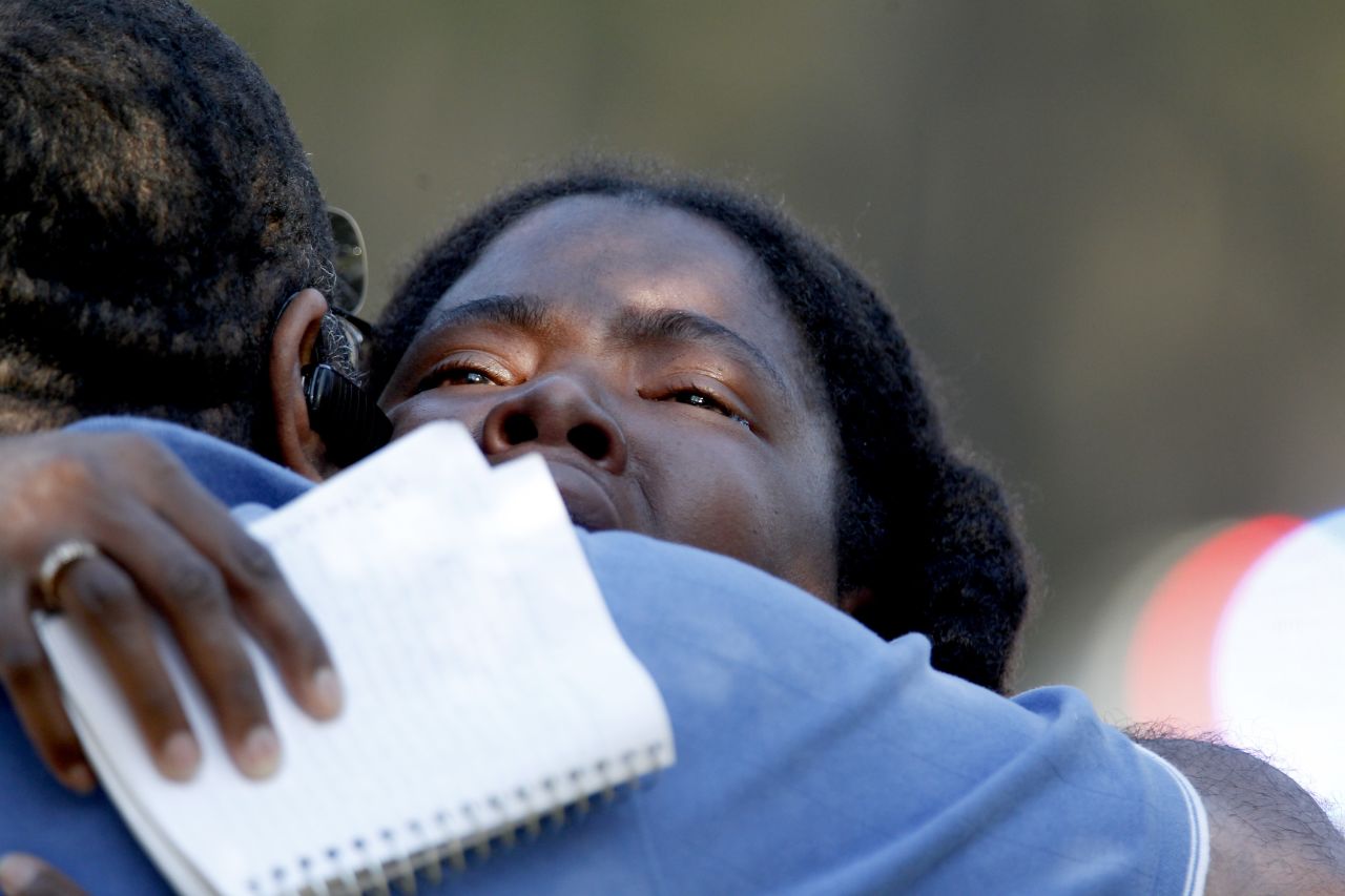 Lone Star College freshman Sheketa Taylor embraces her father, Judson Gimblin, after a shooting on the suburban Houston campus Tuesday, January 22. Three people were left wounded on Lone Star's North Harris campus, authorities said, after an apparent argument between two men. 