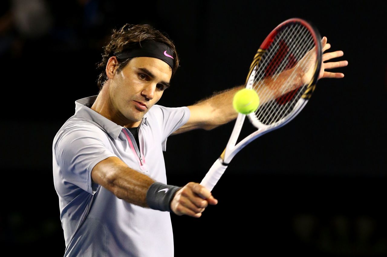 Federer plays a backhand to Tsonga on January 23.