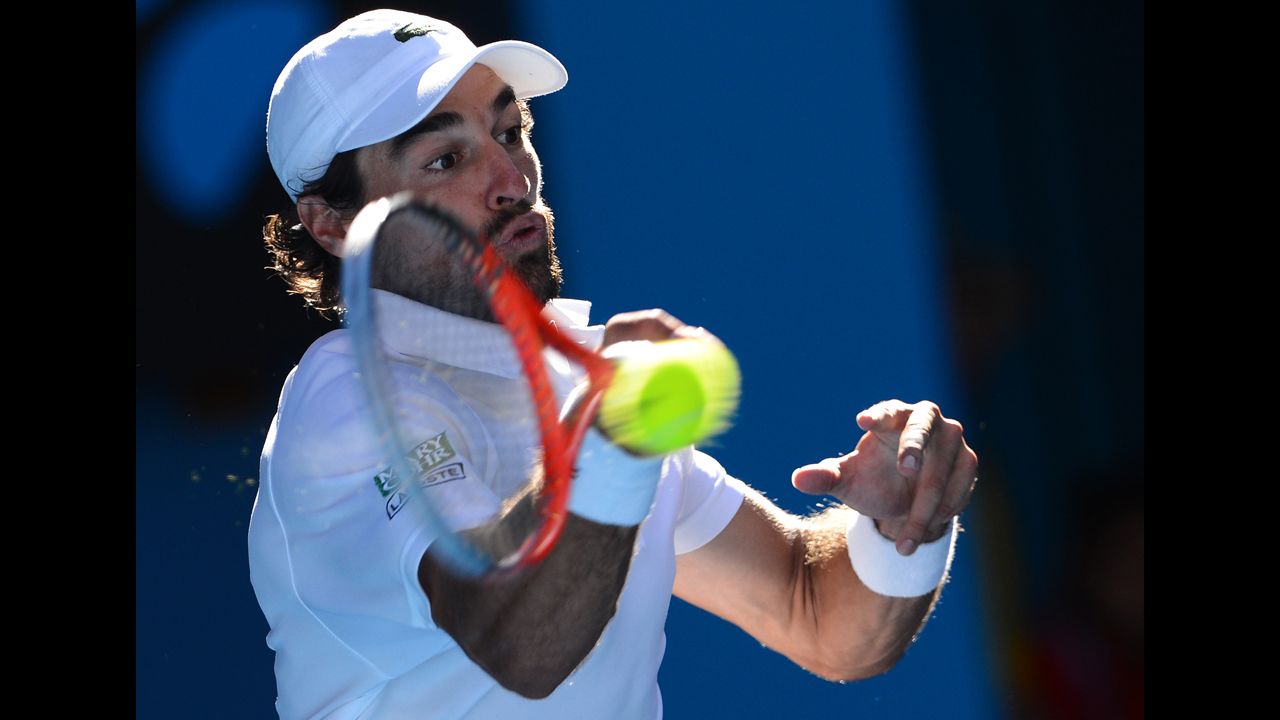France's Jeremy Chardy hits a return against Britain's Andy Murray during their men's singles match on January 23. Murray defeated Chardy 6-4, 6-1, 6-2.