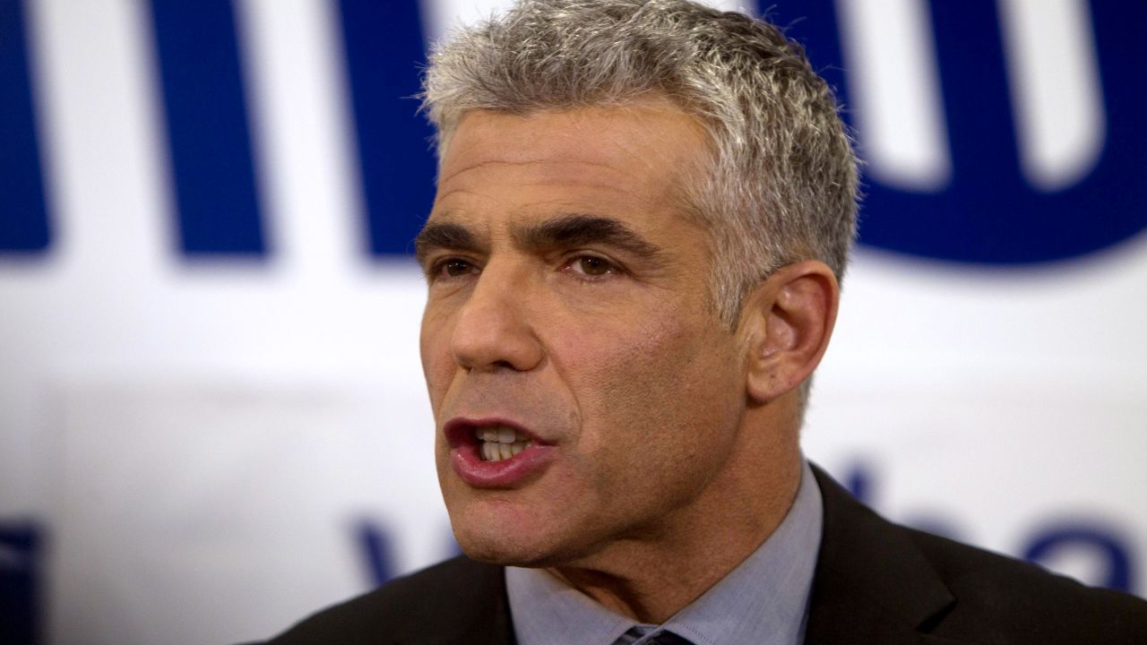 Yair Lapid, chairman of Yesh Atid party, speaks to supporters early Wednesday in Tel Aviv, Israel.