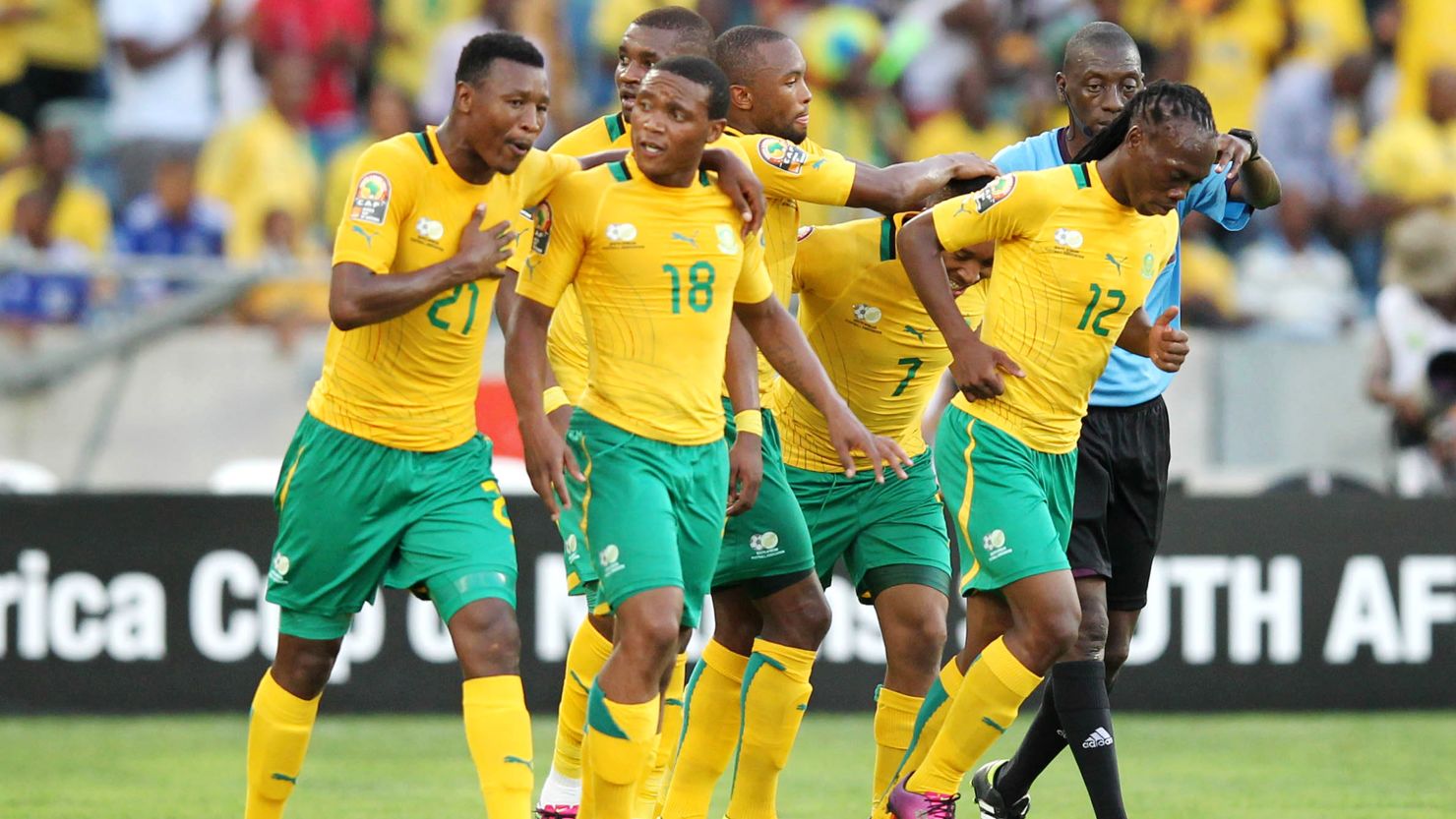 South Africa's players celebrate on their way to a 2-0 win over Angola in Durban Wednesday.