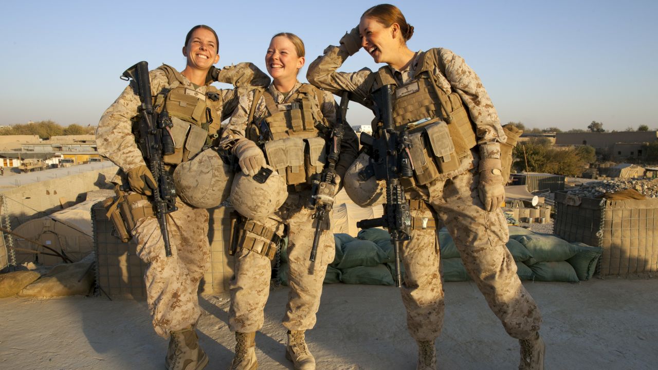 From left, Marines Sgt. Sheena Adams and Lance Cpl. Kristi Baker and Navy Hospital Corpsman Shannon Crowley work with a Female Engagement Team in Afghanistan in November 2010.
