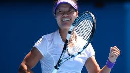 Chinese tennis star Li Na celebrates after beating Maria Sharapova to reach the Australian Open final.