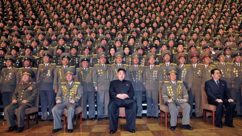 North Korean leader Kim Jong Un poses with security officers in this government-published photograph.
