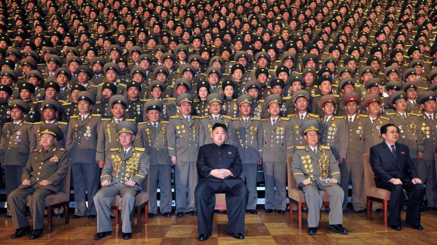This undated picture released from North Korea's official Korean Central news Agency on November 27, 2012 shows North Korean leader Kim Jong-Un (C) during a photo session with participants in the national meeting of chiefs of branch social security stations at an undisclosed location in North Korea. AFP PHOTO / KCNA via KNS ---EDITORS NOTE--- RESTRICTED TO EDITORIAL USE - MANDATORY CREDIT "AFP PHOTO / KCNA VIA KNS" - NO MARKETING NO ADVERTISING CAMPAIGNS - DISTRIBUTED AS A SERVICE TO CLIENTS (Photo credit should read KCNA VIA KNS/AFP/Getty Images)