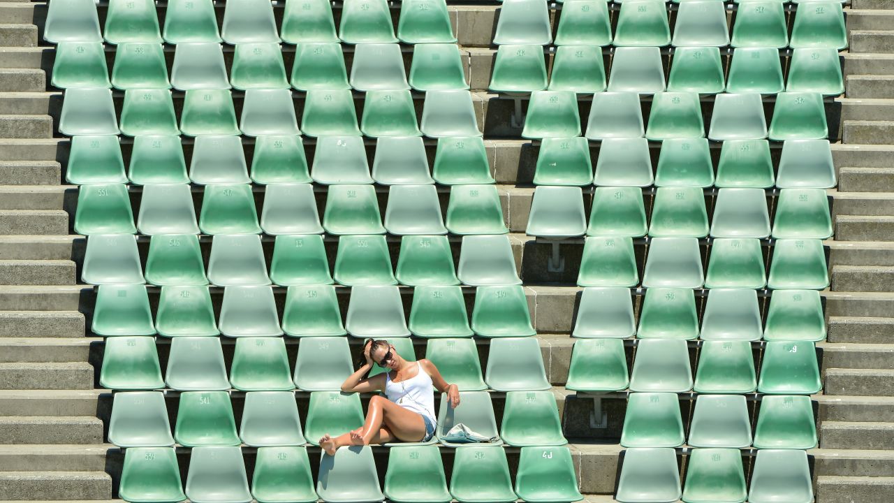 A tennis fan sits in the stands during Day 11 of the Australian Open at Melbourne Park on January 24.