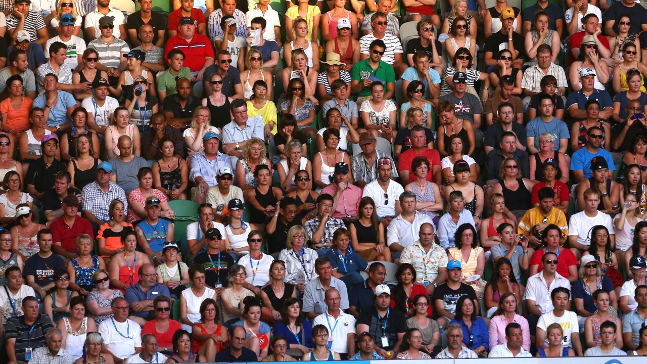 Fans watch the men's semifinal match between Ferrer and Djokovic on January 24.