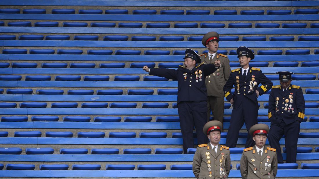 North Korean soldiers relax at the end of an official ceremony attended by leader Kim Jong Un at a stadium in Pyongyang in April 2012.