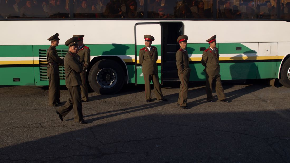 Soldiers board a bus outside a theater in Pyongyang in April 2012.