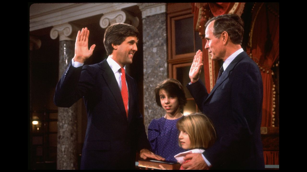 Vice President George H. W. Bush swears in Kerry after he won his first Senate seat, as Kerry's daughters Alexandra, second left, and Vanessa look on in 1985.