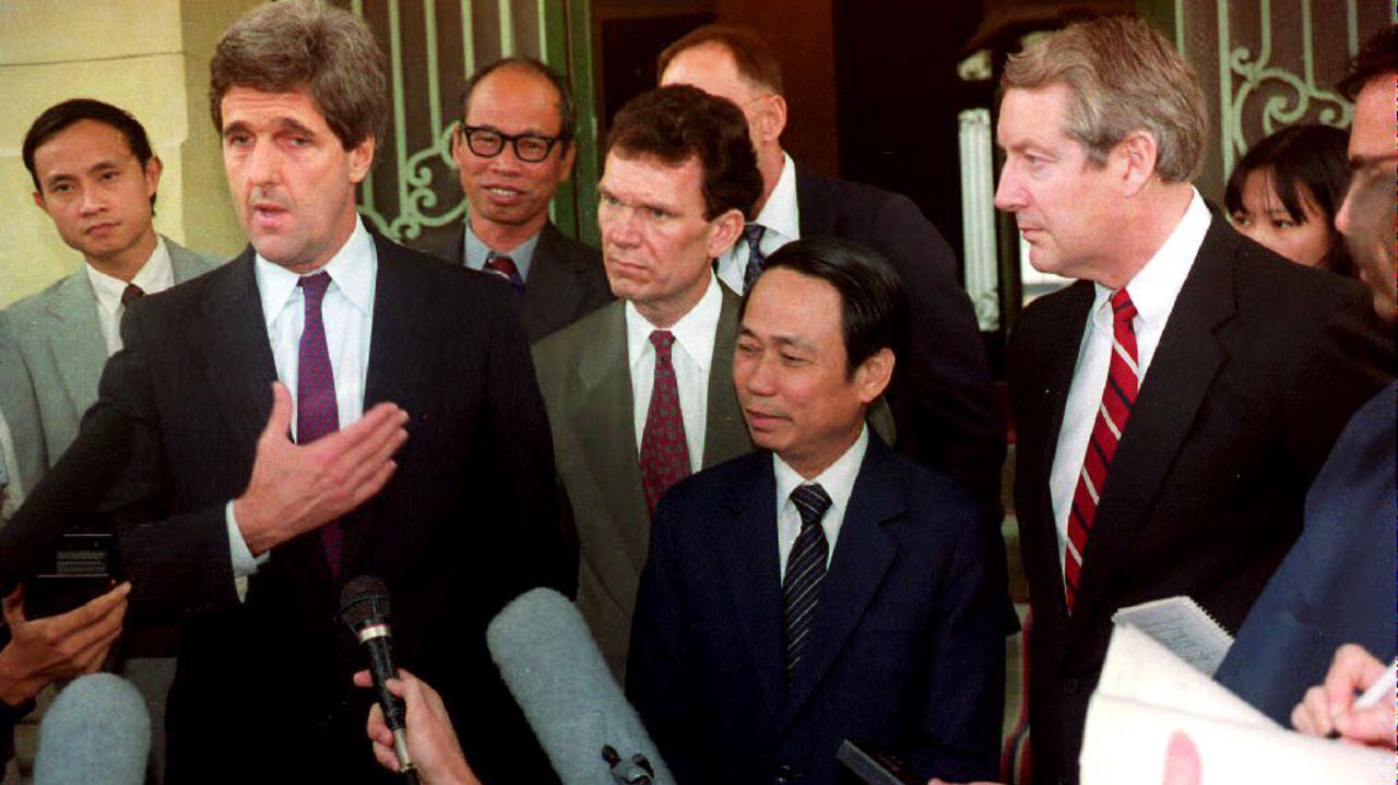 Kerry and Vietnamese Deputy Foreign Minister Le Mai, second from right, talk with reporters after the arrival of Kerry, Sen. Hank Brown and Sen. Tom Daschle on November 16, 1992, for talks with the Vietnamese government on the fate of U.S. servicemen still missing after the war.