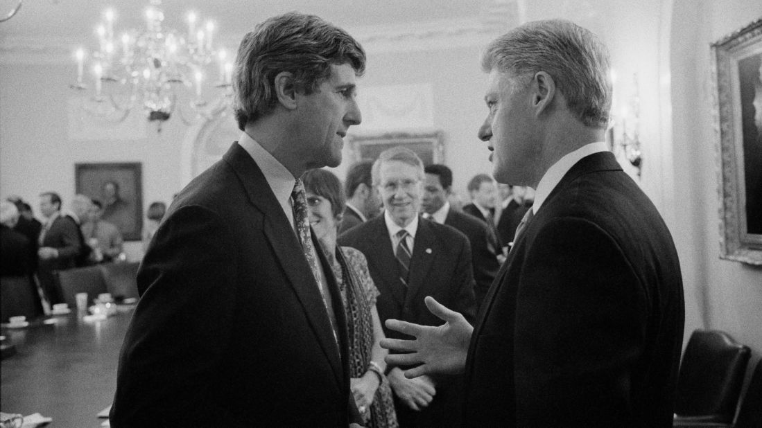Clinton speaks to Kerry at a Democratic leadership meeting in Washington on August 8, 1996.