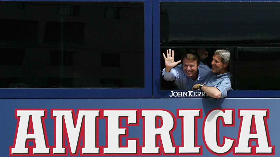 Kerry and running mate John Edwards wave from their bus at a rally stop on July 30, 2004, in Scranton, Pennsylvania.