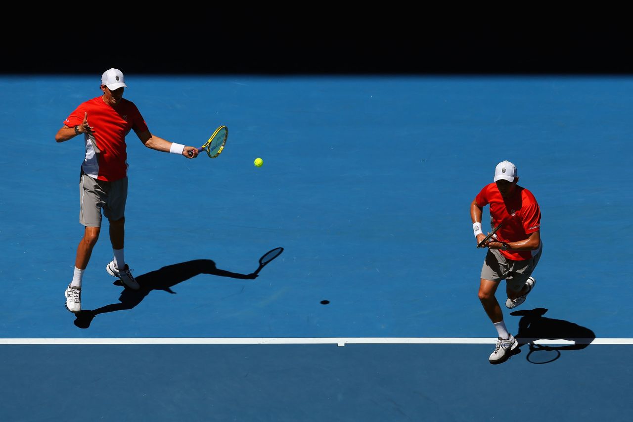Brothers Bob, left, and Mike Bryan battle Simone Bolelli and Fabio Fognini of Italy in a doubles semifinal match on January 24.  The brothers won 6-4, 4-6, 6-1.