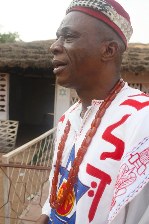 Eze A.E. Chukwuemeka Eri, the king of a community in Aguleri, wears a white shirt with the Star of David stitched on the front. He is building a center for the study of Judaism. (Courtesy: Chika Oduah.)