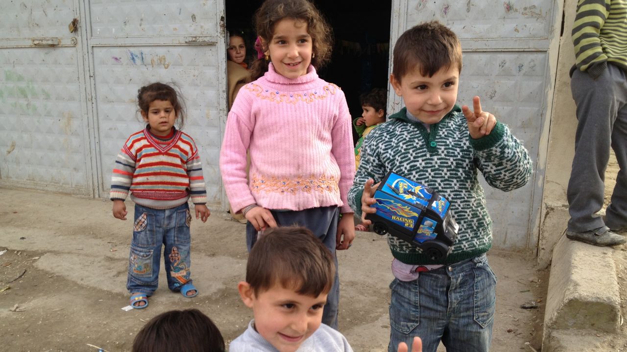 Refugee children outside a building housing displaced Syrians in the Turkish border town of Hacipasa.