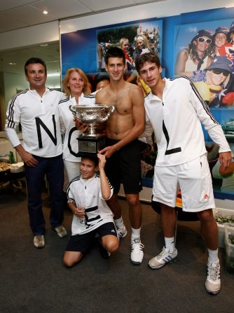The Djokovic family celebrate his 2008 Australian Open title in the locker room. Speaking to CNN about his time growing up in Serbia, Djokovic said: "It was really hard to succeed and I have to thank God for the big support from my father and my mother and all the family. They believed in me ... "