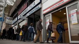 People queue to enter a government employment office as it opens on December 4, 2012 in Madrid, Spain. Spain's registered unemployment figures rose by 74,296 hitting a new record of 4.91million according to Madrid's Labor Ministry.