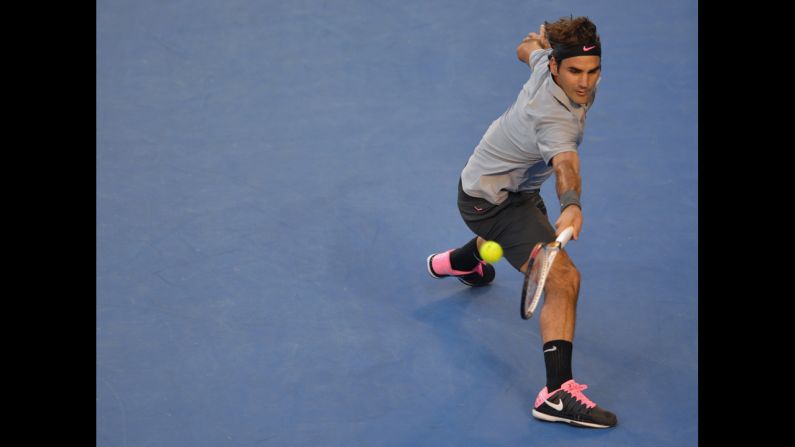 Roger Federer hits a return on January 25.