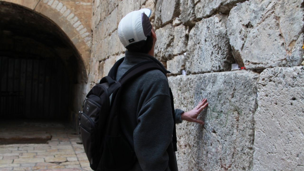 Writer Arri Eisen at a "small Wailing Wall" in the Old City of Jerusalem.