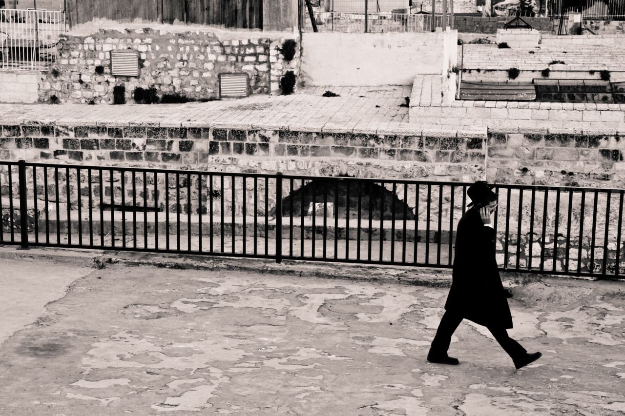 An Orthodox Jew talks on his cell phone on the roof of the Jewish Quarter in the Old City of Jerusalem.