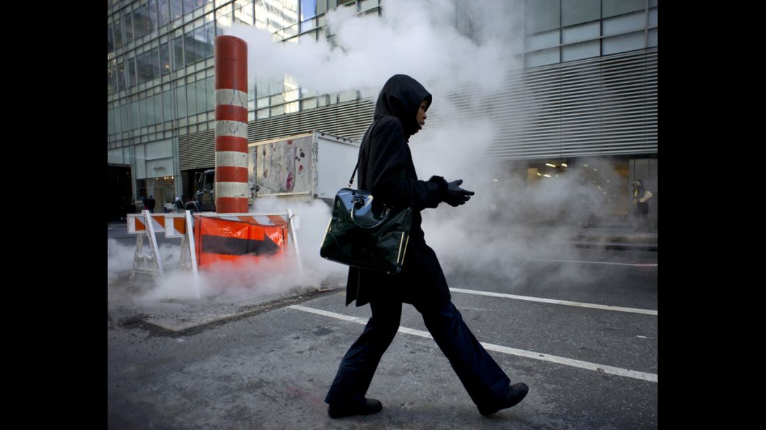 A woman pulls on her gloves on January 23 in New York.