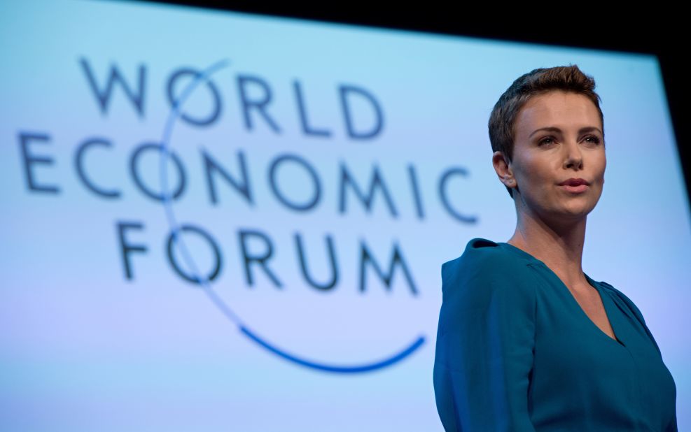 Theron gives a speech after picking up the 2013 World Economic Forum Crystal Award for her humanitarian work. 