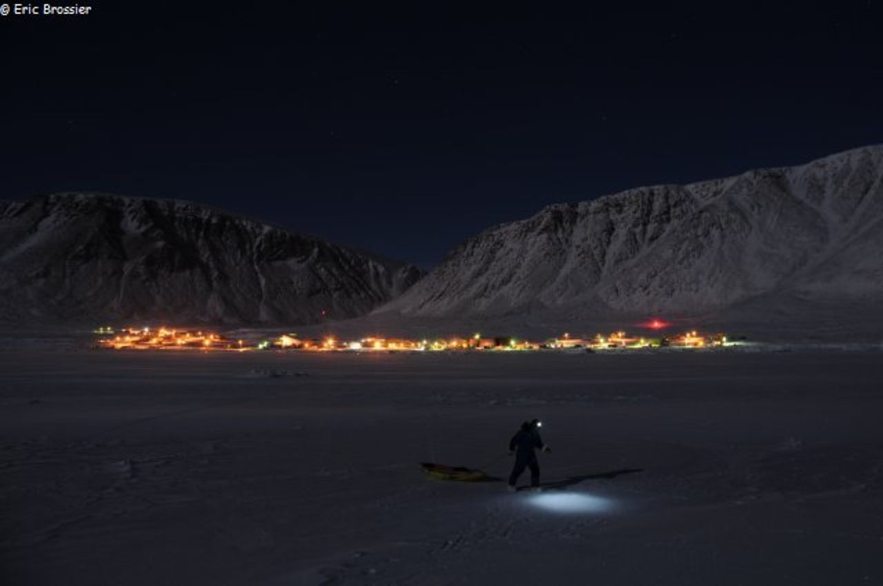 Eric Brossier pulls a sled through the snow near Grise Fiord. This year marks the first time his family have spent the winter months close to a human settlement.