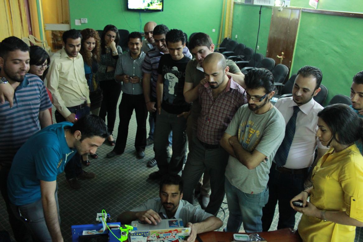 Bilal Ghalib, an Iraqi-American advocate for hackerspaces in the Middle East, told CNN he wants to see "A thousand hackerspaces from Turkey to Morocco." Here, he demonstrates new equipment to members of Fikra Space, Baghdad's first hackerspace.