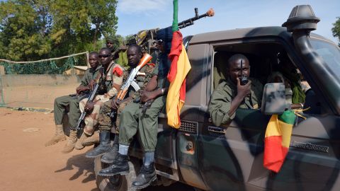 Malian soldiers patrol in a street in Diabaly on Wednesday.