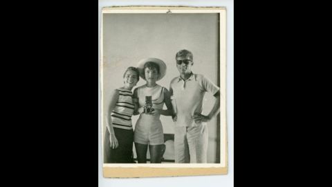 Photograph of Ethel, Jackie and John F. Kennedy taken by Jackie looking into a mirror, circa 1962.