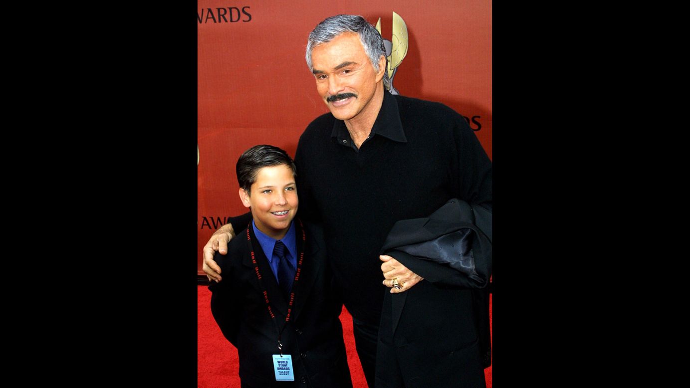 Reynolds arrives with son Quinton at the First International World Stunt Awards in 2001.