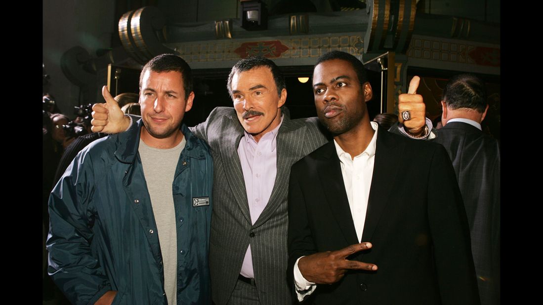 Reynolds poses with Adam Sandler, left, and Chris Rock after a remake of "The Longest Yard" in 2005.