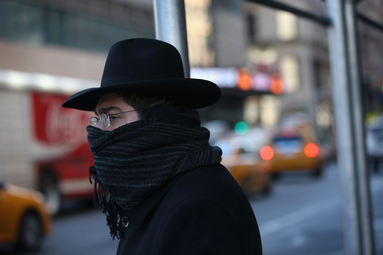 A pedestrian bundled up against the cold walks through the streets of Manhattan on Friday, January 24, in New York City. Polar air settled in over the northeastern U.S. Wednesday, with temperatures in the teens and 20s. Forecasters warned that "bitterly cold conditions" were expected across much of the Northeast, Mid-Atlantic and Mideast through this weekend.
