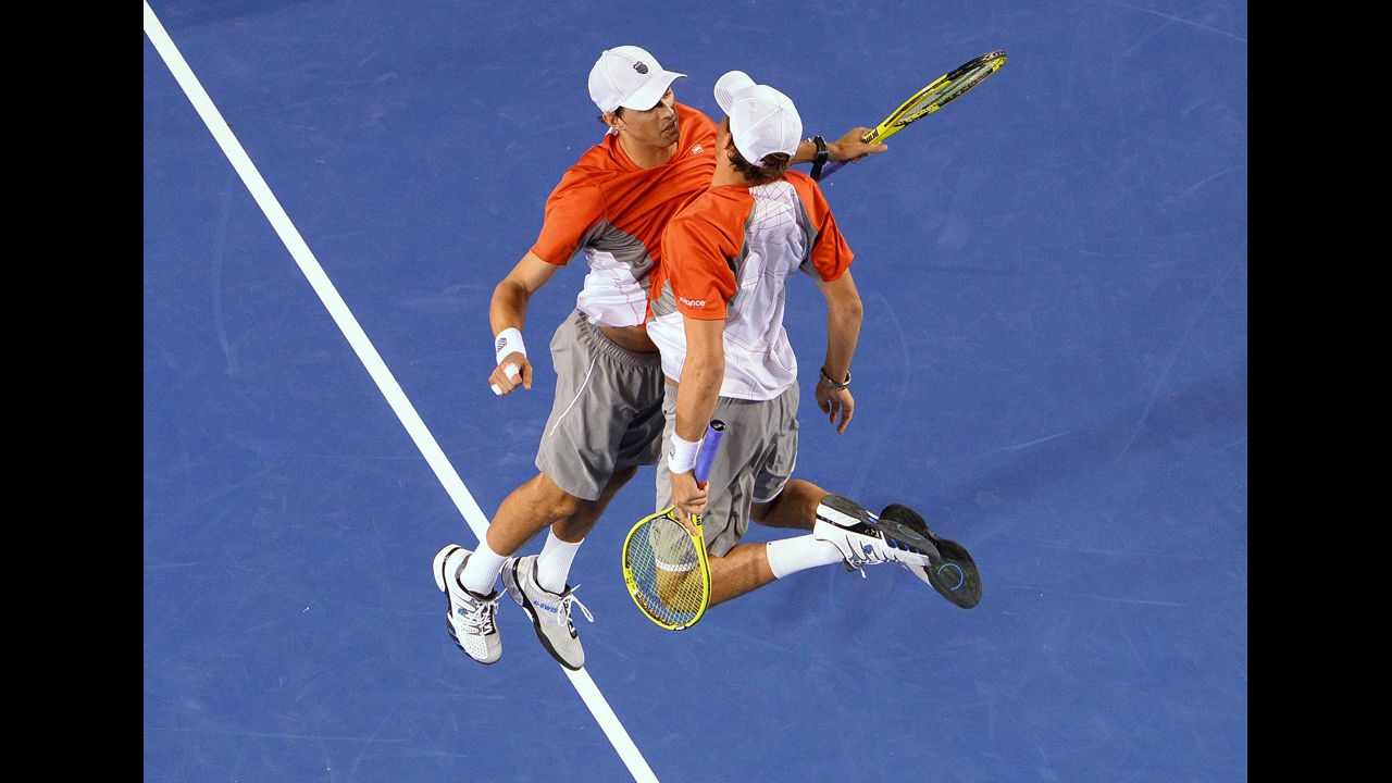 Mike Bryan, left, and his brother, Bob Bryan, of the U.S. celebrate after their victory over the Netherlands' Robin Haase and Igor Sibling during the men's doubles final January 26.