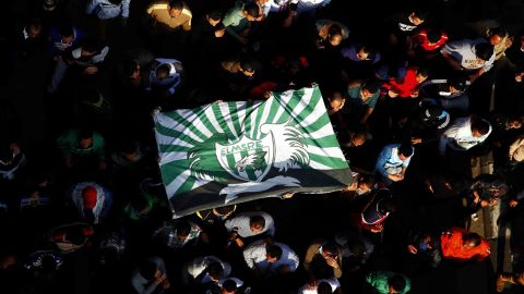 Egyptian protesters and fans of Al-Masry football club wave their club colors as they take part in a demonstration in front of the prison in the Egyptian Suez Canal city of Port Said on Friday, January 25, calling for the prisoners who are suspected of killing 74 fans of Al-Ahly club during a football match in February 2012 not to be transferred to Cairo to attend their trial. A judge sentenced 21 people to death for their roles in the riot last year.