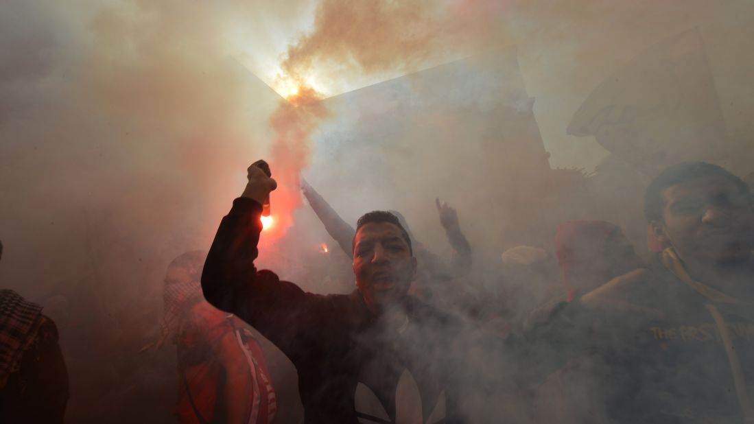 Egyptian fans of Al-Ahly football club rally outside the club's headquarters in Cairo on January 26.