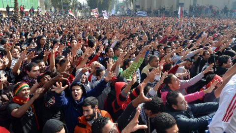 Egyptian fans of Al-Ahly football club celebrate outside the club's headquarters in Cairo on January 26.