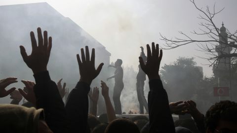 Al-Ahly football club supporters celebrate outside the club's headquarters in Cairo on January 26.