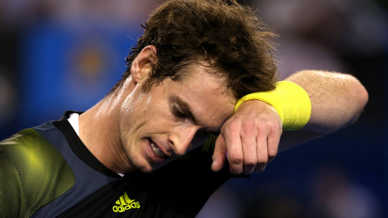 Murray wipes his face during his men's final match against Djokovic on January 27.