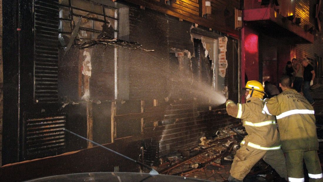 Firefighters work to extinguish the blaze that broke early Sunday.