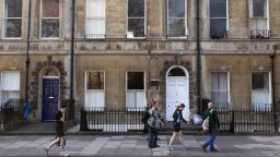 People walk past a house at 4 Sydney Place, Bath, once occupied by the novelist Jane Austen and her family.
