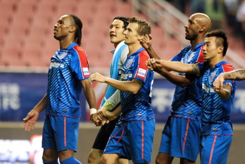 Didier Drogba (far left) and Nicolas Anelka (second from right) attending a training session in Shanghai. Their spells in China didn't last long though and the pair exited in 2013. 