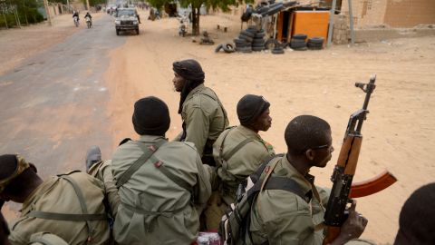 Malian soldiers enter the historic city of Timbuktu on Monday, January 28. 