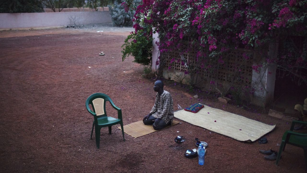 A man prays in the recently liberated town of Douentza on January 28.